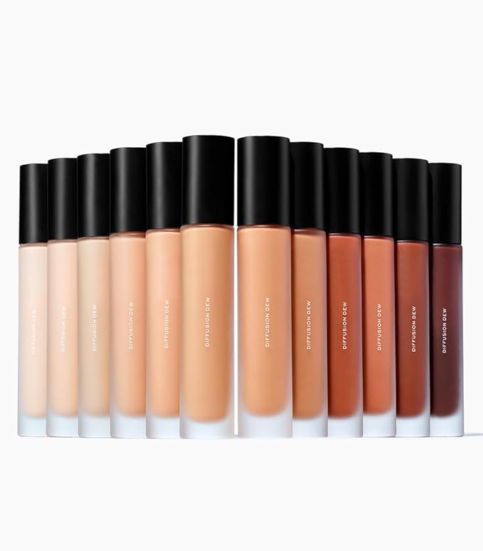 MAKE Beauty Diffusion Dew Skin Tint. Sheer to Medium Coverage Radiant Finish. Blurring, Smoothing, and Brightening for Glowing Complexion. Enhanced with Niacinamide and Adenosine. Amber 10